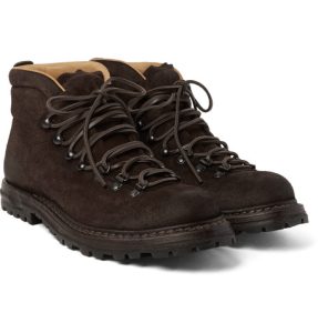 Durable black suede hiking boots with sturdy soles, ankle height, and comfortable lining, perfect for outdoor adventures and rugged terrains.