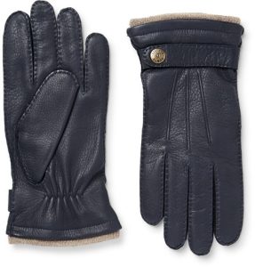 Black leather gloves with beige cuffs, stylish and warm, perfect for winter fashion and outdoor wear.