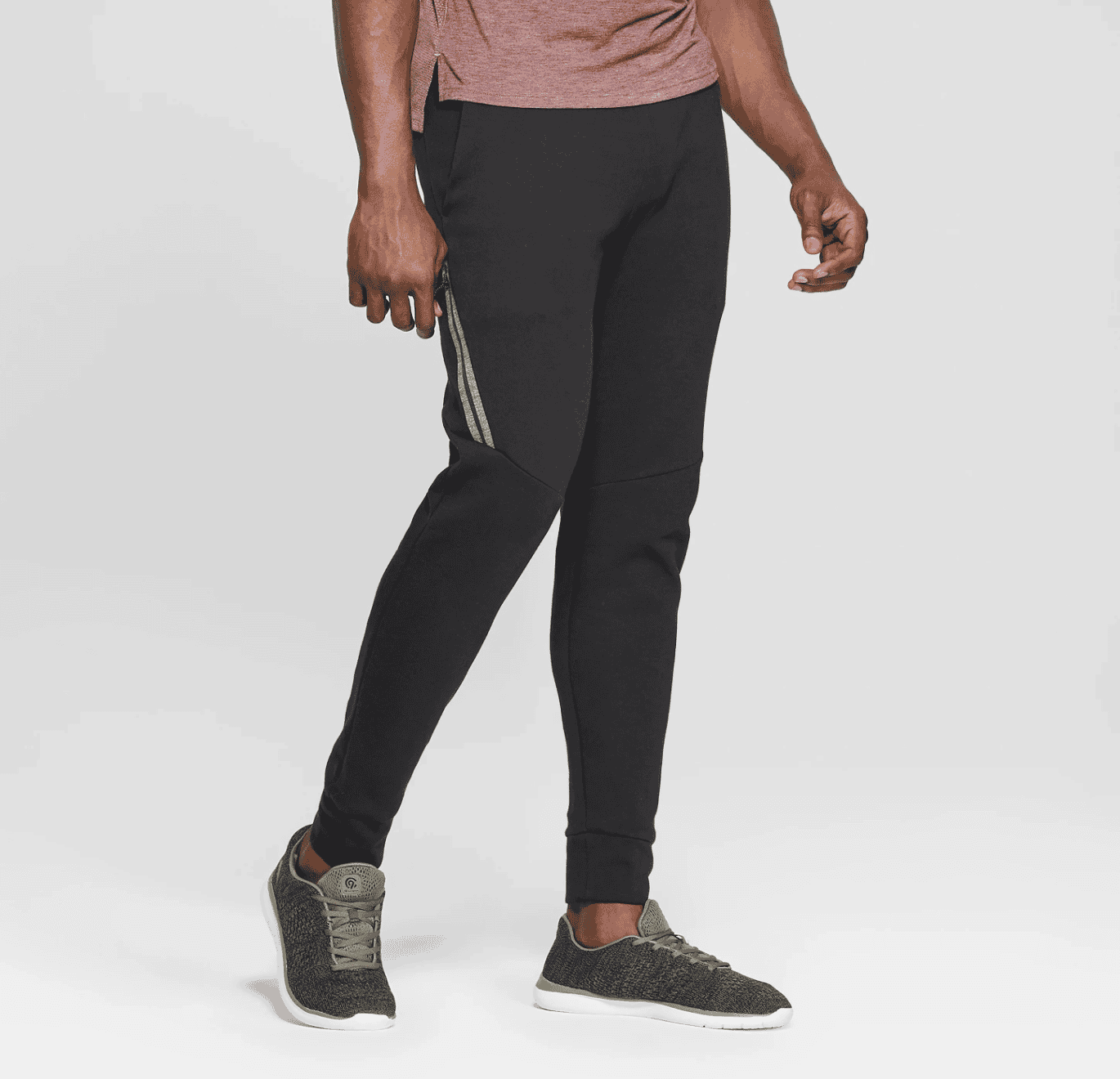 Comfortable men's athletic joggers featuring side stripe detail for activewear and casual wear, paired with sneakers for a sporty look.