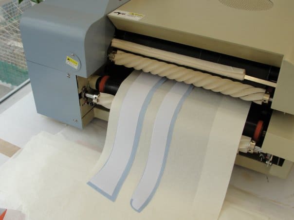 fused collars A high-quality textile fabric printer producing custom printed fabric with precision and vibrant colors.