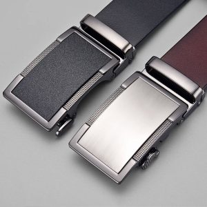 Sleek men's belt buckles in black and silver with textured and smooth finishes, perfect for stylish accessories and corporate fashion.