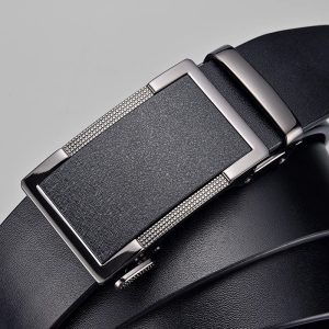 Stainless steel automatic belt buckle on black leather belt for men's fashion and accessories.