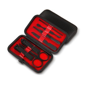 Precision manicure and pedicure grooming kit in a compact black carrying case with red interior.