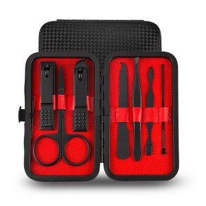 Instrument grooming kit with nail scissors, tweezers, and scissors in a black and red travel case.
