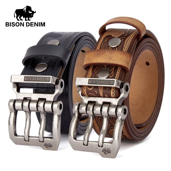 Stylish Bison Denim leather belts with metal buckles, featuring intricate embossed and printed designs in black and brown for men’s fashion accessories.