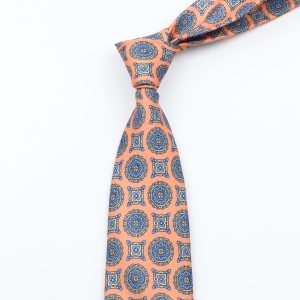 Vibrant peach and blue patterned men's silk tie with intricate geometric design, perfect for formal or business attire.