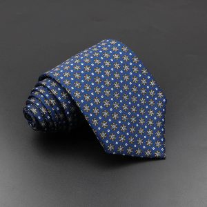 Elegant men's blue patterned silk tie with geometric accents, ideal for formal occasions and professional settings. Perfect accessory for refined style and sophisticated wardrobe.
