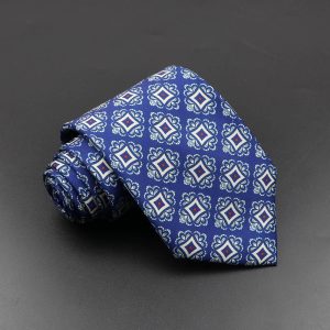 Handsome men's blue patterned necktie with intricate white and red geometric design, perfect for professional or formal occasions, showcasing elegance and style.