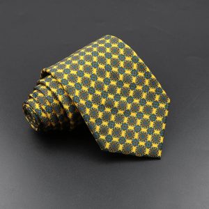 Vibrant men's patterned necktie with intricate yellow, blue, and brown geometric design, perfect for formal or professional occasions.