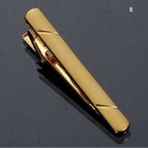 Gold tie clip with sleek design for men's fashion accessories. Elegant jewelry piece perfect for formal or professional attire. High-quality gold finish and craftsmanship.