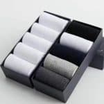 Premium men's dress socks set in black and gray packaging for stylish formalwear and gift-giving.