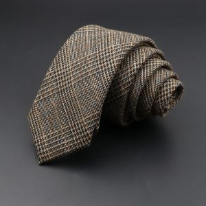 Elegant brown plaid men's tie with a classic pattern, ideal for formal occasions and professional settings. Made from high-quality fabric for a sophisticated office look.