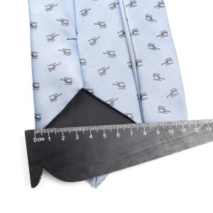 Helicopter patterned light blue men’s dress shirt, measuring approximately 13 cm with a black measuring tape, suitable for formal or business wear.