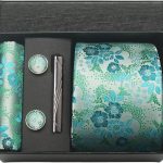 Luxurious turquoise floral-patterned men's gift tie, cufflinks, tie clip, and pocket square set in a black gift box for elegant occasions.
