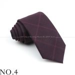 Elegant burgundy tie with subtle checkered pattern, ideal for formal and professional attire, perfect for business meetings, weddings, and events. Made from high-quality fabric for a sophisticated look.
