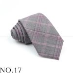 Luxurious gray plaid men's necktie with pink accents, perfect for formal occasions and professional attire. Crafted from high-quality fabric for a sophisticated look.