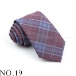 Luxurious maroon and blue plaid men's dress tie, classic style for formal occasions, made from high-quality fabric for a sophisticated look.