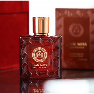Luxurious Jean Miss Pour Homme perfume bottle with intricate geometric design and gold accents, perfect for men's fragrance enthusiasts, placed on a reflective surface with elegant red packaging in the background.