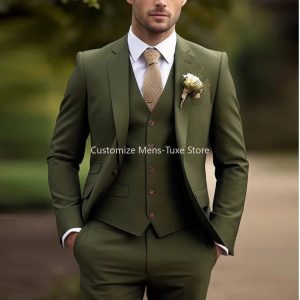 Elegant men's green tailored suit with a white shirt, beige tie, and boutonniere, ideal for wedding or formal occasions, showcasing sophisticated men's fashion and style.