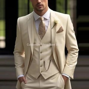 Elegant men's wedding suit in cream color with accessories for formal occasions, tailored with precision for a sophisticated look.
