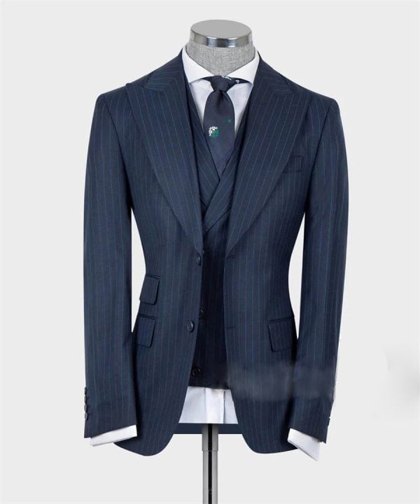 Sharp navy blue pinstripe men's suit with white dress shirt, matching tie, and vest, perfect for formal business or special occasions. Elegant, tailored, and professional look.