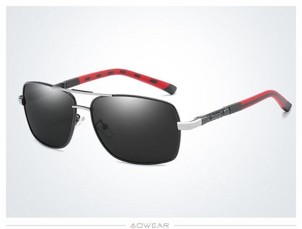 Sunglasses with black lenses, silver frame, and red-accented arms for stylish sun protection.