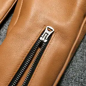 Premium tan leather backpack with sturdy zipper closure, stylish and functional for everyday use.