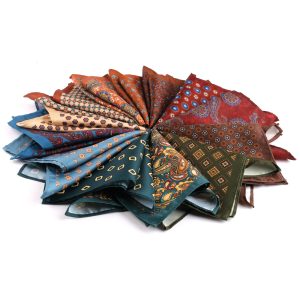 Vivid collection of colorful paisley and floral patterned silk pocket squares with intricate designs and vibrant hues for stylish accessories.