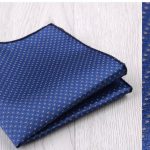 High-quality blue pocket square with a subtle gold dot pattern, perfect for formal or business attire. Crafted from premium fabric, it adds elegance and sophistication to any suit or blazer.