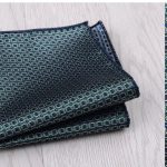 Luxurious navy blue patterned pocket square with intricate gold accents, perfect for formal occasions and adding a touch of elegance to men's fashion.