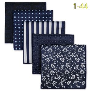 Silk pocket squares collection in navy blue with various white patterns including floral, stripes, checks, and geometric designs, perfect for elegant men's accessories.