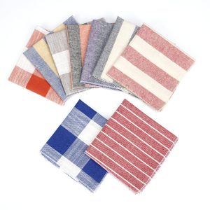 Assorted fabric napkins with striped and checked patterns for kitchen and table decor, eco-friendly and reusable, perfect for everyday use and special occasions.
