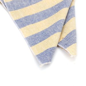 Soft striped cotton fabric in blue and beige, perfect for clothing and home decor projects.