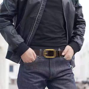 Vintage leather belt with ornate gold buckle for men's fashion accessories. Perfect for casual or stylish outfits, adding a touch of elegance and sophistication. Durable and high-quality material.