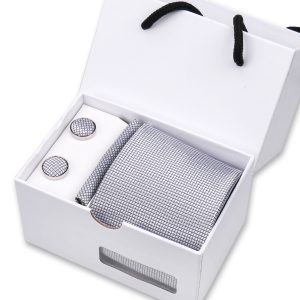 Luxury men's gift set with stylish tie, cufflinks, and pocket square in a sleek white box. Perfect for formal occasions, anniversaries, or special celebrations. Elegant fashion accessories included.