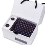 Black and purple magnetic luxury cufflinks and tie clip in a white gift box, perfect for elegant fashion accessories and men's style statements.