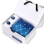 Elegant blue patterned silk tie and matching cufflinks gift set in a white box, perfect for formal occasions and stylish accessories.
