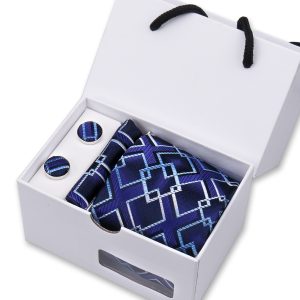Elegant men's accessories gift set including a silk tie, cufflinks, and pocket square featuring geometric blue patterns, ideal for stylish formal occasions.