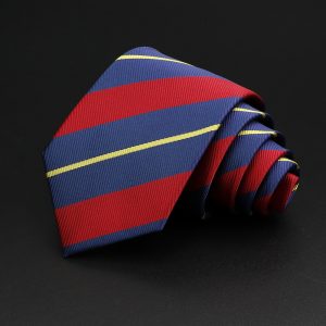 Fashion men's silk necktie with red, blue, and yellow striped pattern on black background. Elegant accessory for formal attire, perfect for business or special occasions.