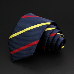 Bright navy blue tie with red and yellow diagonal stripes on a black background, showcasing elegant men's accessories perfect for formal occasions.