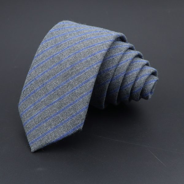 Dark gray men's dress tie with subtle blue pinstripes, neatly rolled on a black background. Perfect for formal occasions, business attire, or professional settings. Quality fabric and stylish design by DeoVeritas.