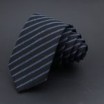 Striped black and blue silk tie with diagonal pattern, ideal for formal occasions and professional attire. Made from high-quality fabric, perfect for office wear or special events.