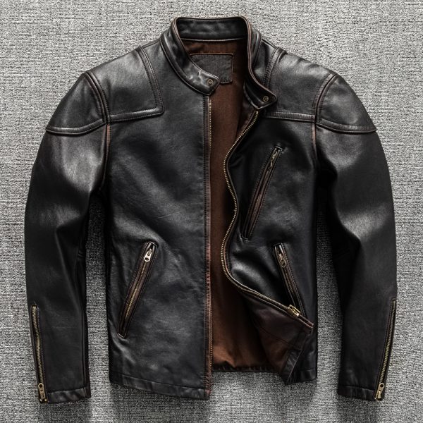 Luxury black leather motorcycle jacket with multiple zippered pockets and a classic stand collar on a textured gray background. Perfect for stylish and durable outerwear.